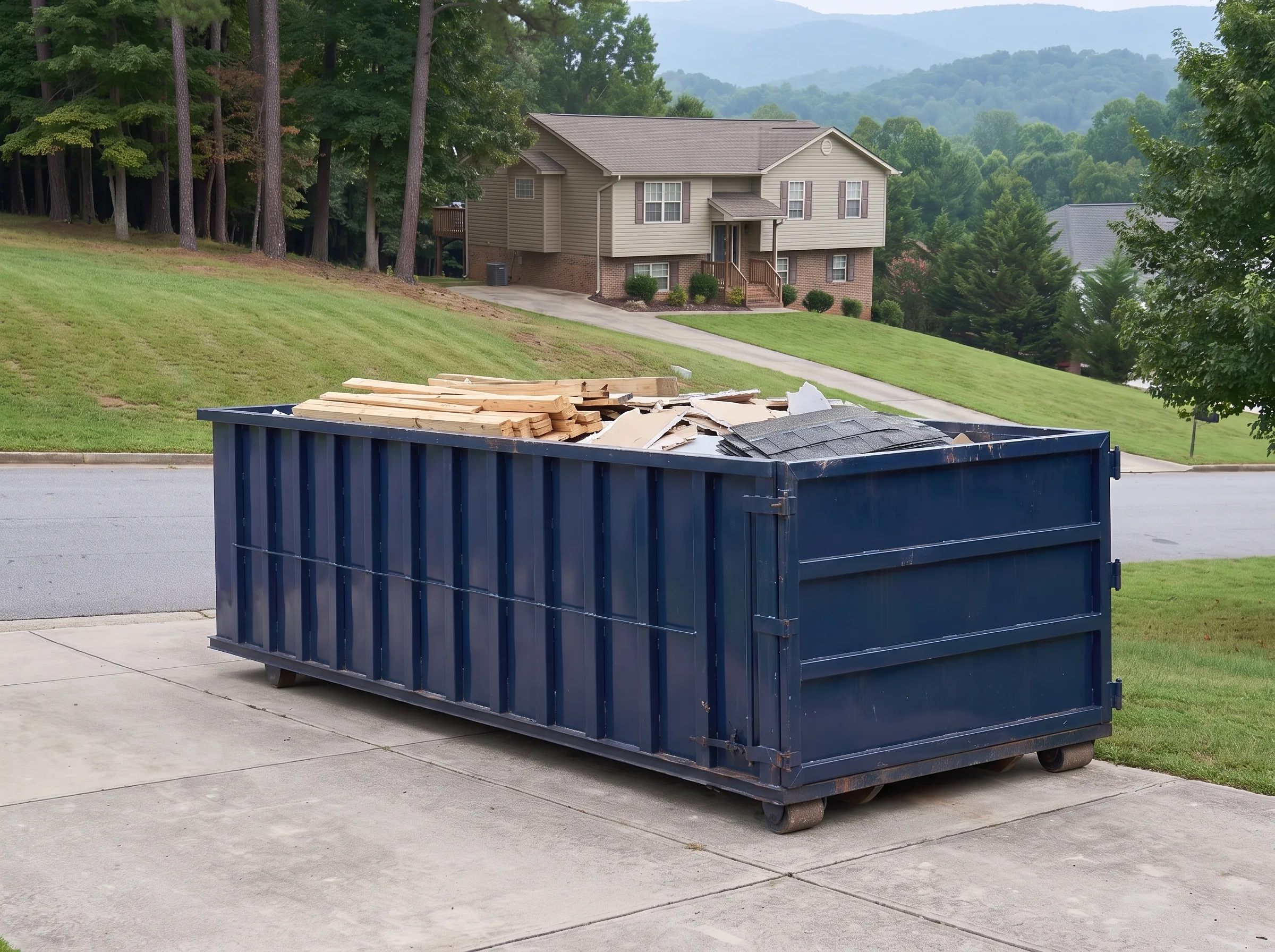 Roll-off dumpster being loaded in Stanly County, NC